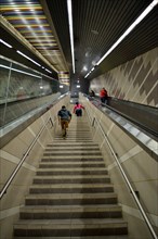 Passengers of a DART subway train climb the stairs of the Uptown station in Dallas, TX