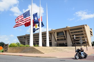 Dallas, Texas, USA. 10th July, 2016. Flags at half staff at Dallas City Hall