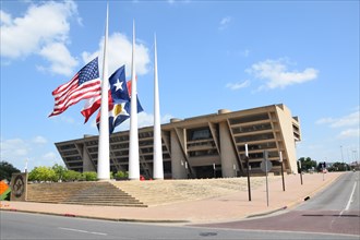 Dallas, Texas, USA. 10th July, 2016. Flags at half staff at Dallas City Hall