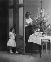 Mother and child with Christmas tree
