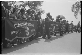Marchers carrying labor union banners, 1963