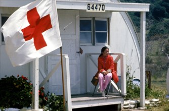 A woman waits for medical treatment