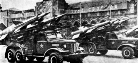 A right front view of several vehicle-mounted Soviet SA-3 Goa surface-to-air missiles.