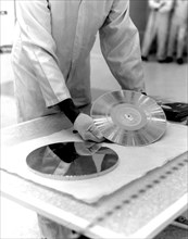The Voyager 1 Golden Record is prepared for installation on the spacecraft