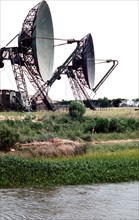 Two large dish-shaped radar antennas