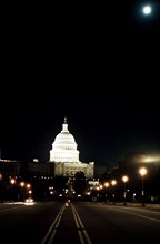 A full moon is visible above the United States Capitol.