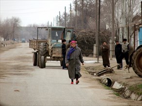 Uzbek woman walks down the street