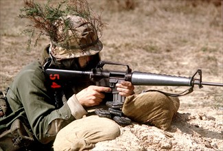 A U.S. Army soldier fires an M.16A1 rifle