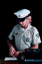 A US Army military policeman takes fingerprints.
