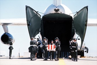 An Army color guard stands at attention