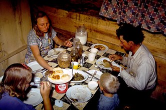 1940s family eating dinner in their dugout home New Mexico