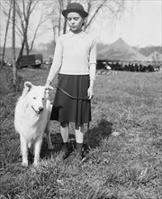 A young girl and her dog ca. April 1936