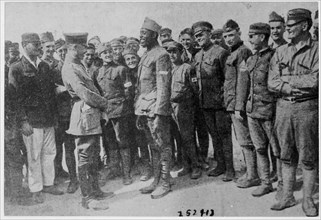 African American World War I soldier in a German prison camp speaks to a German officer.