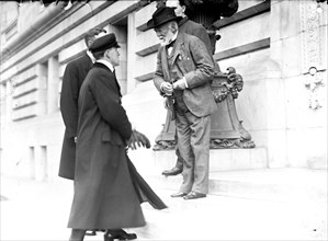 Andrew Carnegie talking with men