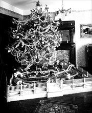 Christmas tree in early 1900s living room  ca. 1918