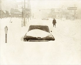 City Street During Snowstorm; Car Surrounded by Snow January 27
