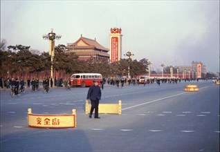 Street Scene with Signs and Bicyclists in Peking