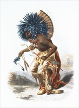 Hidatsa warrior wearing ceremonial costume for the Dog Dance. ca 1839