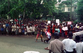 Liberian locals dance in the streets