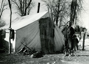 Man and Child in Front of Tent