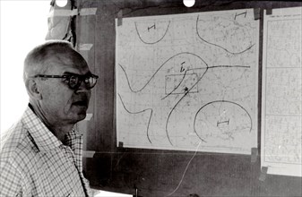 Man Examines National Weather Service Wind Charts 1961
