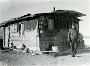 Man in Front of Building with Animals