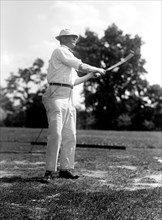 Man playing golf in 1914