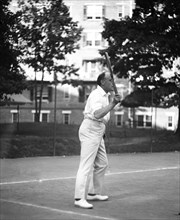 Man playing tennis ca. 1919