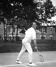 Man playing tennis ca. 1919