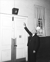 Man pointing to a speaker system