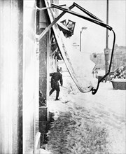 Man Shoveling Snow on City Street; Collapsed Awning November 1966