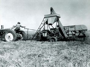 Man Working with Farm Equipment 1934