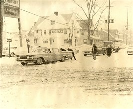 Men Pushing Cars on Snow