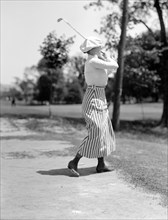 Miss Edith Gordon playing golf ca. 1916