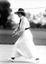 Miss Frances Lippett playing in a tennis tournament