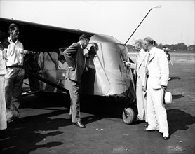 People examining the Waterman Arrowplane