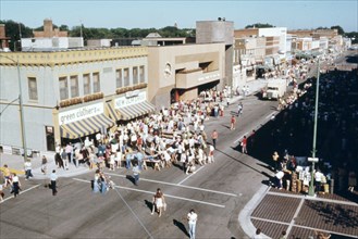Residents gather on a downtown street in New Ulm