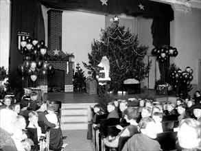 Santa Claus on stage at a Christmas pagaent ca. 1922