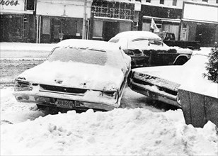 Snowbound Car Stuck Sideways on Street