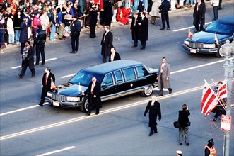 The presidential limousine drives down Pennsylvania Avenue during Bill Clinton's second inauguration in January 1997.