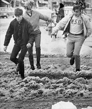Three Young Men Crossing Slushy Street Novmeber 1966