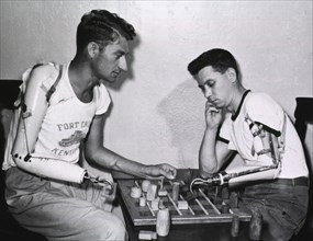 Two men with prosthetic arms
