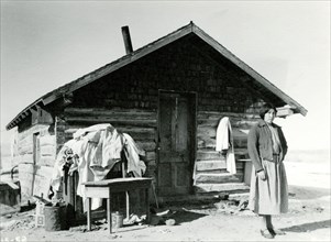 Woman in Front of Cabin