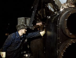 Working on the cylinder of a locomotive