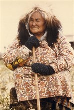 Elderly Eskimo lady in traditional wolverine parka ruff June 1973