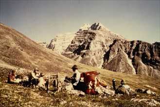 July 1975- Mount Igikpak from Angiaak Pass area near Reed River headwaters, camp site and campers in foreground