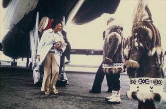 Early 1970s - Visitor to Kotzebue being greeted by Eskimos working for local tour group