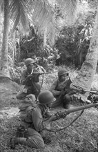 Three KNIL soldiers with different weapons at hand (stengun, bren machine gun and rifle); Date December 1948; Location Indonesia, Dutch East Indies, Sumatra