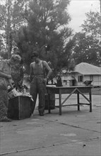 Dutch soldiers decorating a Christmas tree in Indonesia, Dutch East Indies, Sumatra ca. December 1948