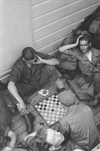 Indonesia History - Sailors working on the drafts game; Date 16 June 1947 Location Batavia, Indonesia, Jakarta, Dutch East Indies, Tandjong Priok
